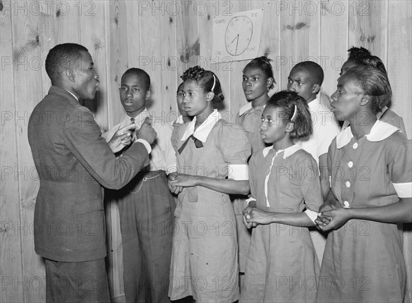 African American School choir led by Robert Pierce, school principal. They won state championship. Gee's Bend, Alabama 1939