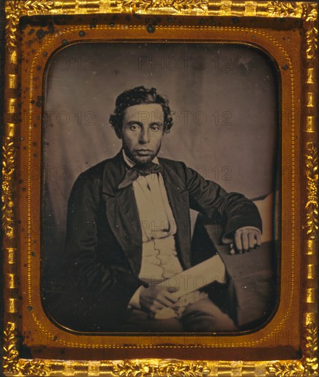 Alfred Francis Russell, three-quarter length portrait, full face, seated at desk 1857