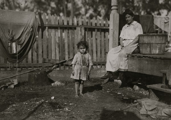 Alma Crosien, three-year-old daughter of Mrs. CoRa Croslen, of Baltimore. Both work in the Barataria Canning Company. The mother said, "I'm learnin' her the trade." 1911