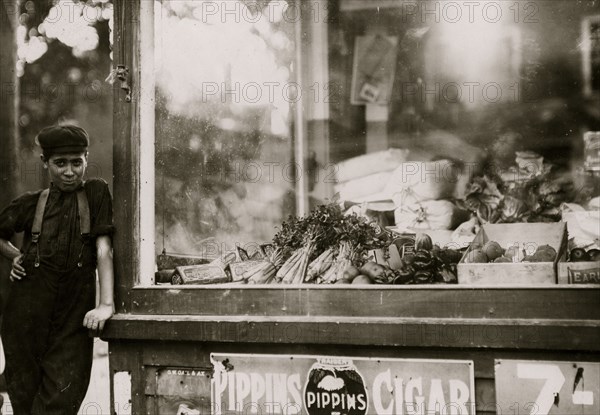 Portuguese immigrant boy works in folding-in room of the Wood Mill. Is an illiterate 1911