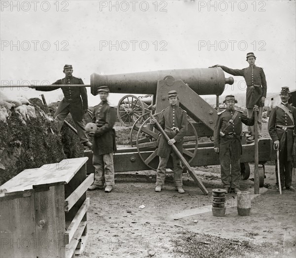 Arlington, Virginia. Soldiers of 4th New York heavy Artillery loading 24-pdr. siege gun on wooden barbette (Ingalls Battery? Fort Corcoran) 1862