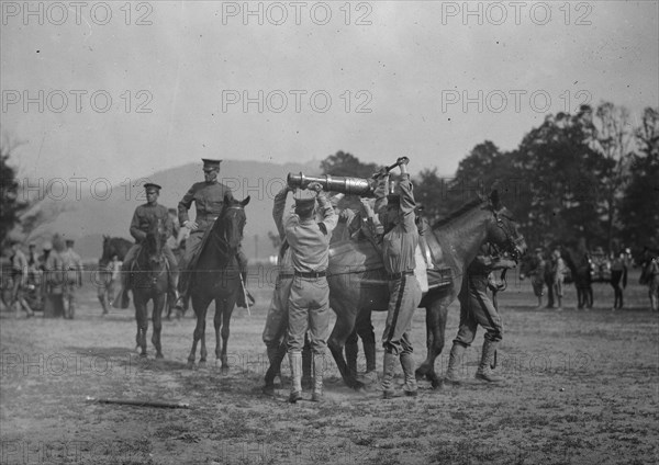 Army Cadets Lift Large Artillery Piece from a Horse