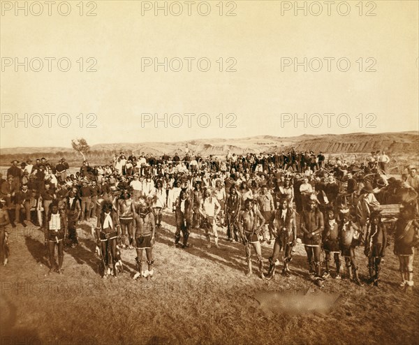 At the Dance. Part of the 8th U.S. Cavalry and 3rd Infantry at the great Indian Grass Dance on Reservation 1890