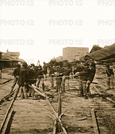 Atlanta, Georgia. Sherman's men tearing up railroad track 1864