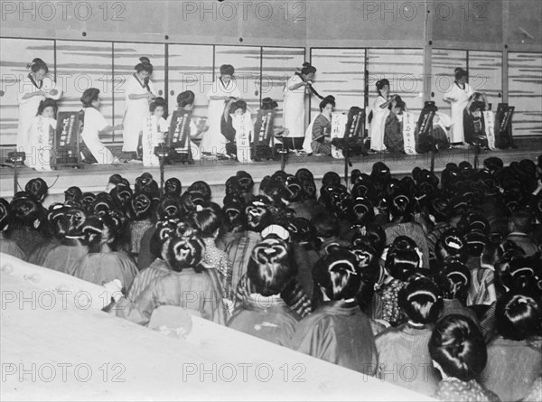 Auditorium with Hairdressing Contest in front of Audience