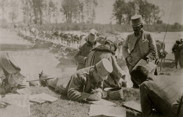 Aust. Staff studying maps