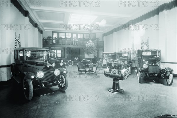 Automobiles on Display in Tent Under American Flag Banners 1921