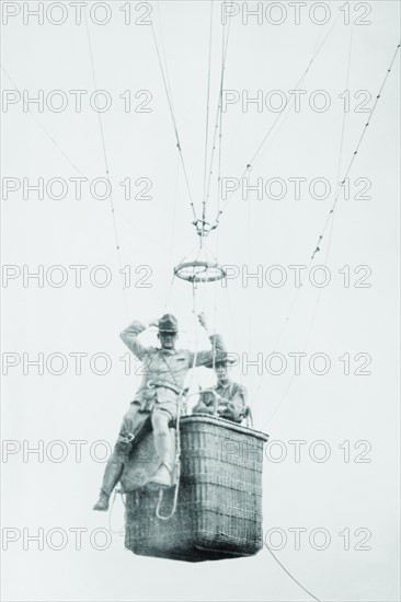 Balloon jump by a parachutist hanging from a basket suspended by it but out of the image.
