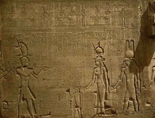 Bas-relief and hieroglyphics cover wall in the Temple of Hathor, located in Dendara, Egypt. 1880