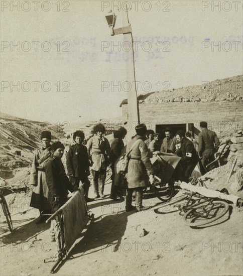 Bicycle stretchers bringing Russian wounded to a surgical station 1905