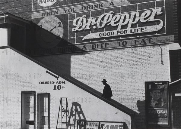 Black going in colored entrance of movie house on Saturday afternoon, Belzoni, Mississippi Delta, Mississippi 1939