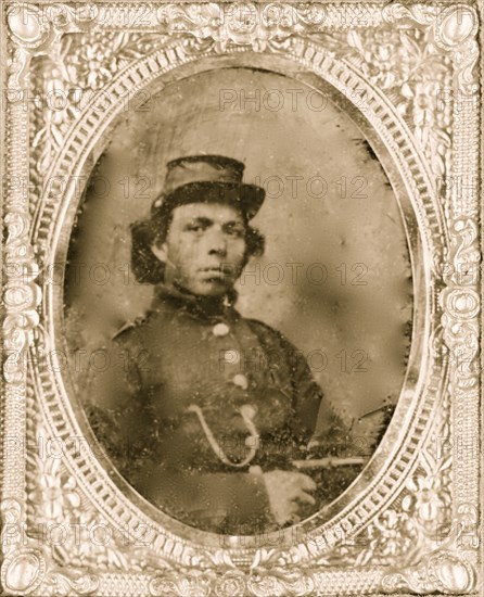 Black soldier seated with pistol in hand, watch chain in pocket 1865