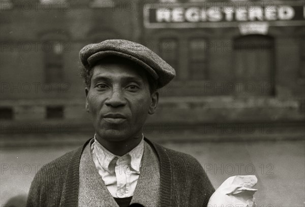 Black waiting for freight train to leave Dubuque, Iowa 1940