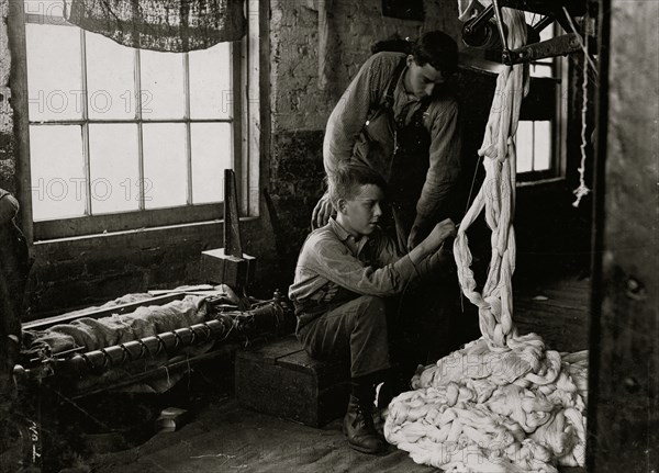 Boy at warping machine. Been there 2 years. Clyde Cotton Mill. 1908