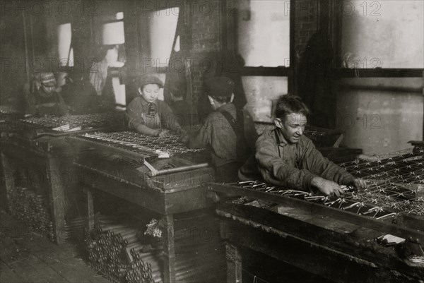 Boys "linking" bed-springs. 14 and 15 years old. 1917