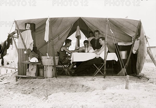 Card game in tent, Tent City, on beach, Rockaway, N.Y.  1910