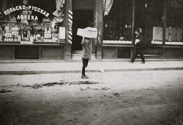 Carrying wood home 1910