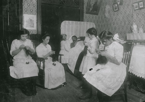 Italian family crocheting bags. Father sick in bed 1912