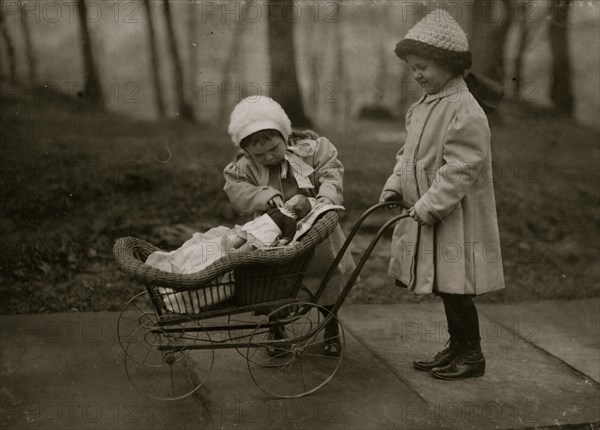 Children playing with Campbell Kid dolls. 1912