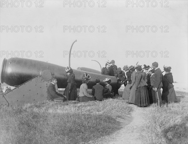 Class from Hampton Institute, Hampton, Va., looking at cannon at Fort Monroe 1899