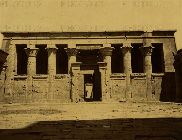 Courtyard and temple with columns connected by panels; Temple of Edfu 1880