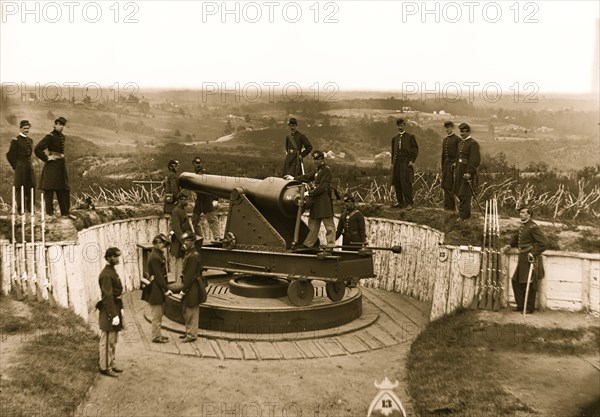 Massachusetts Heavy Artillery, and crew of 100-pdr. Parrott gun on iron barbette carriage at Fort Totten 1865