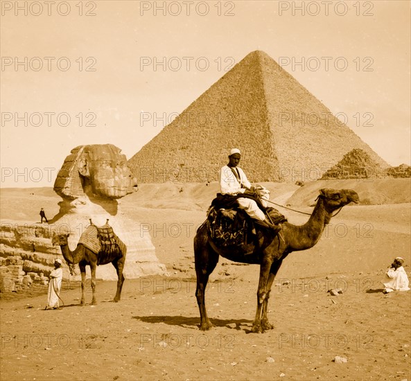 Egypt, Great Pyramid, sphinx, man on camel 1910