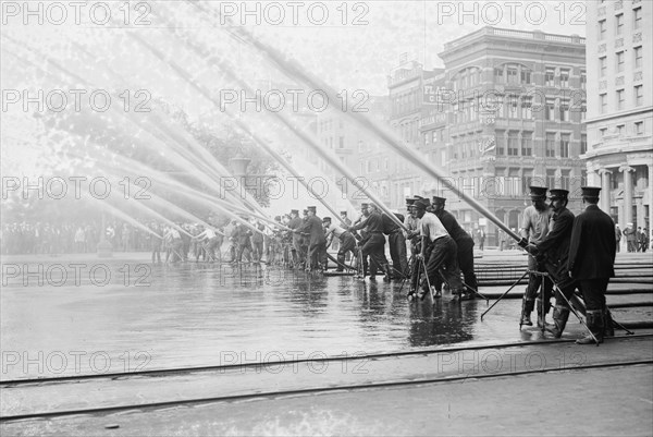 Fireman testing high-pressure hoses, New York