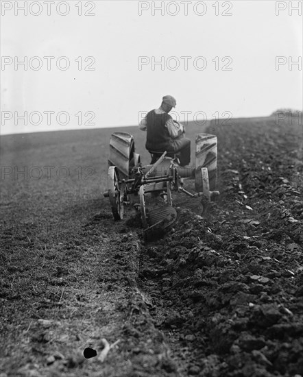 Ford Tractor plowing field 1925