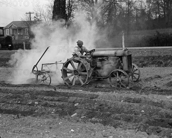 Ford Tractor plowing field 1925