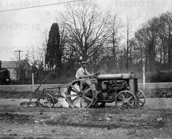 Ford Tractor plowing field 1925