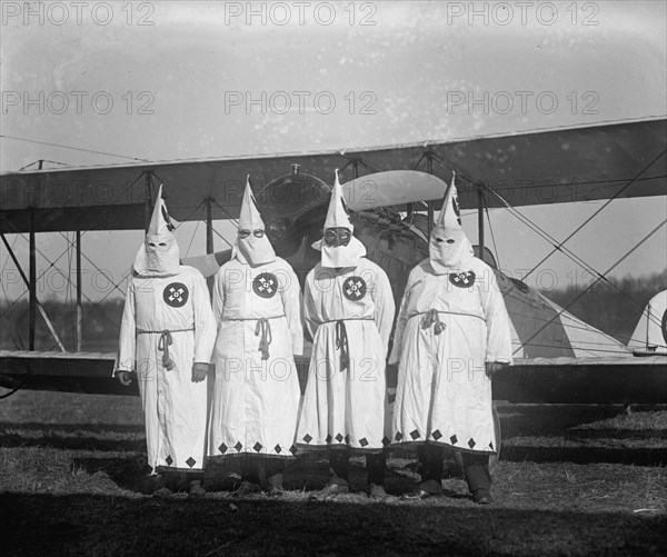 Four Hooded White Sheeted Ku Klux Klan Member pose in Robes & Hoods in front of Airplane 1922