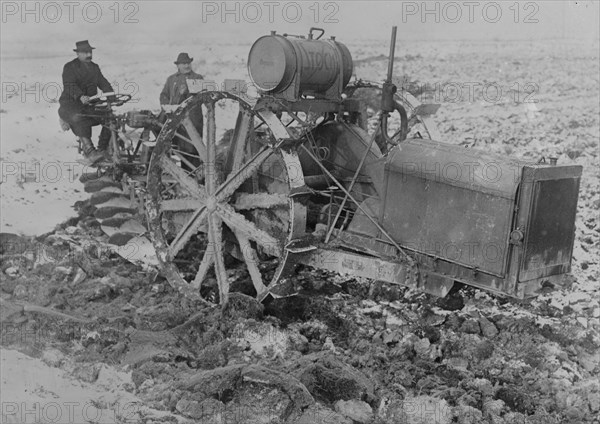 German Designed Huge Tractor digs for unearths potatoes.