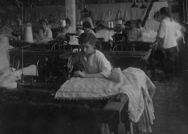 Hemming curtains on machine  1917