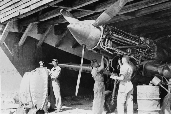 Ground crews of American Air Forces keep the engines tuned up for the Flying Tigers. 1942