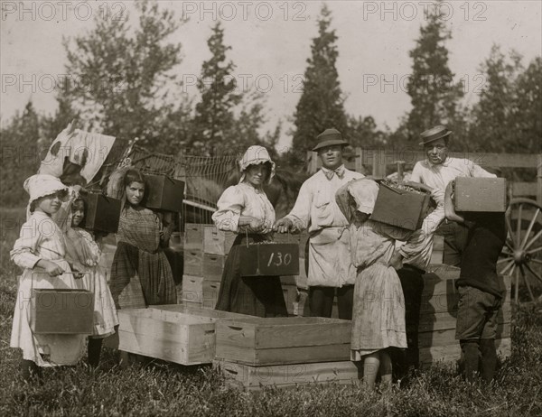 Group of children carrying in their pecks to the "bushel man."  1910