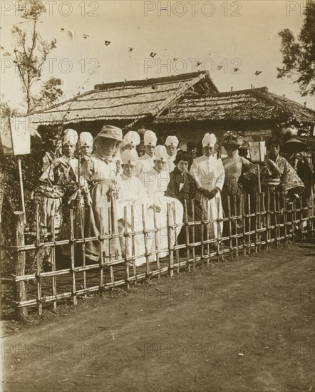 Japanese medical personnel and others dressed in Western and traditional style clothing  1905