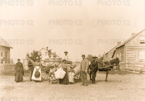 Indians carrying baskets to the trading village - P. Daly, Jr., the basket buyer 1894