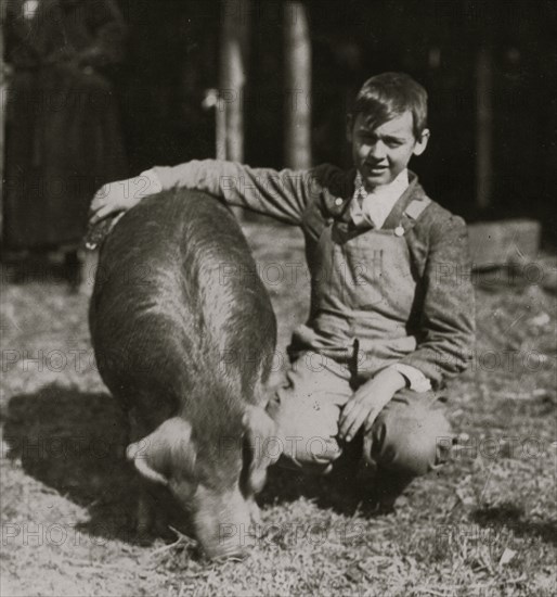 Guy Baily, prize winner, - a 14 year old Club Member from Lewis Co. with his exhibit. State 4 H Club Fai 1921