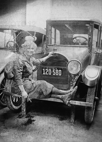 Helen J. Owen, in New York repairing a car