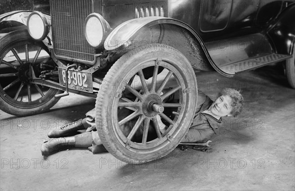 Helen J. Owen, in New York repairing a car