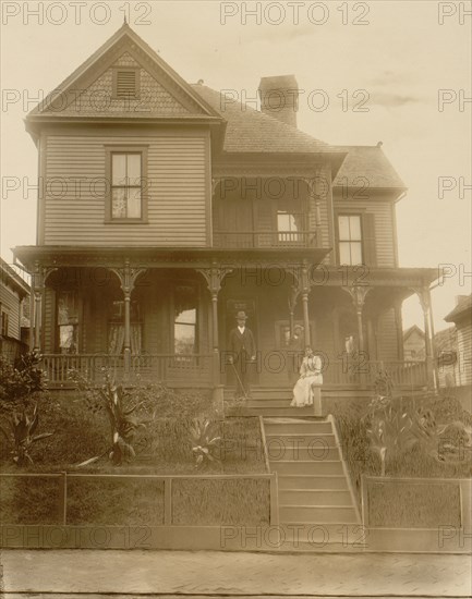 Home of an African American in Atlanta, Georgia, with man, woman & Boy in front of house 1899