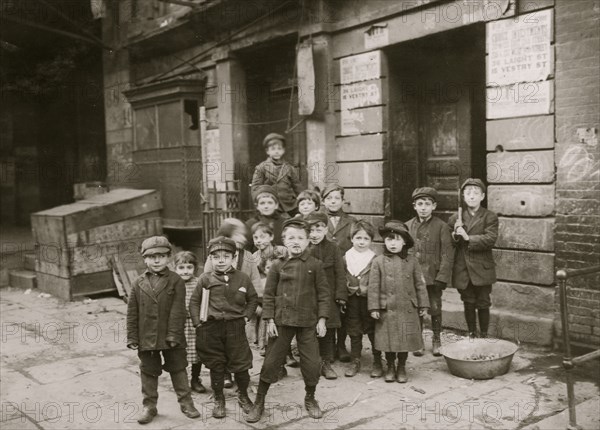 In an alley back of a moving picture theatre on First Street. Children were hanging about the "stage" entrance--"peeking in."  1910