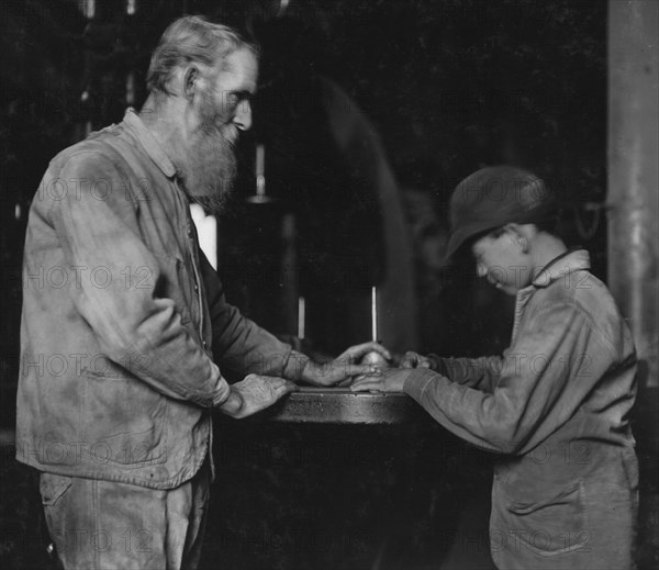 Indiana Mfg. Co. Peru, Ind. The old and the new. Old man has been there 33 years. Boy starting in, working with a board saw 1908