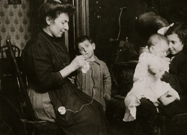 Italian Families manufacture lace from their tenement apartment 1911