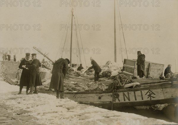 Japanese officers directing the unloading of supplies, Chemulpo AKA Inchon 1904