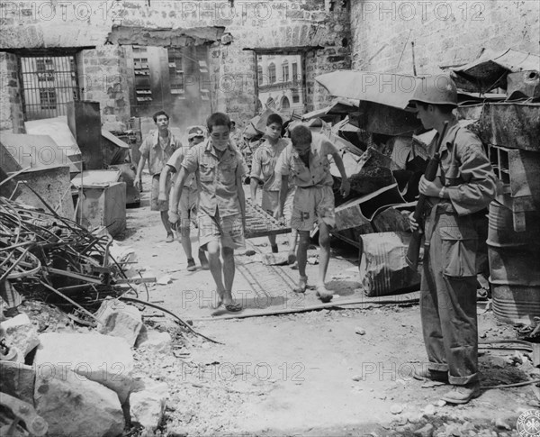 Japanese prisoners of war being guarded by Americans--probably in the Philippines 1944