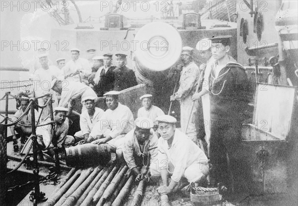 Japanese Sailors Scour the decks of their Warship 1905