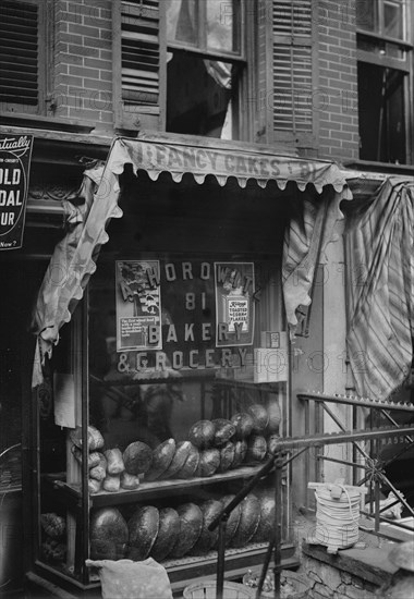 Jewish Bakery "Horowitz" on Lower East Side of New York advertises Fancy Cakes on Its awning and have both Rye Bread and Pumpernickel in the Window