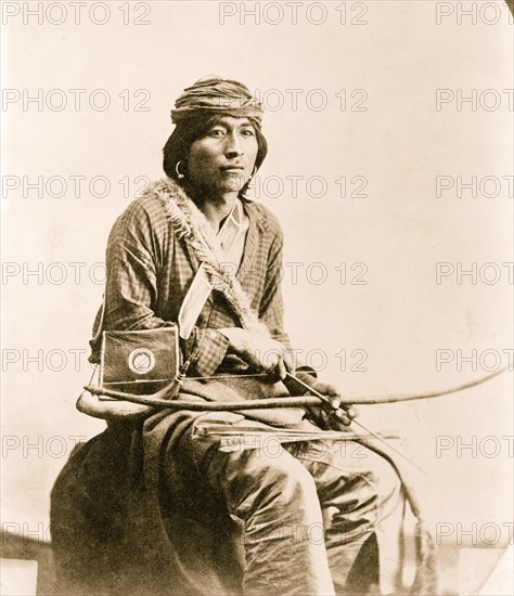 Jim, a Navajo Indian,  holding bow and arrows 1914